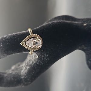 G-6 Silvertone ring with pear cut clear stone with clear accents